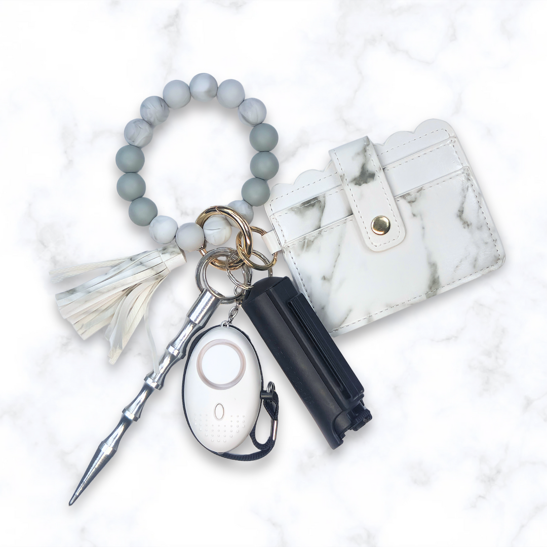 White marble beaded safety keychain set with wallet, pepper spray, and alarm.