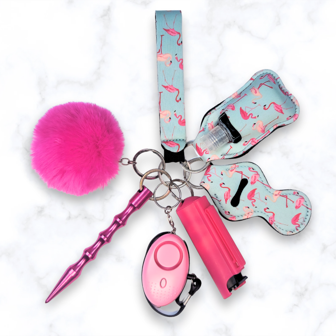 Pink flamingo safety keychain set with kubaton and pepper spray. 