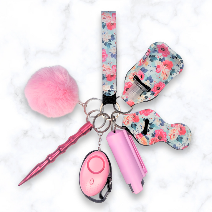 Blue floral self-defense keychain set with pepper spray and alarm.