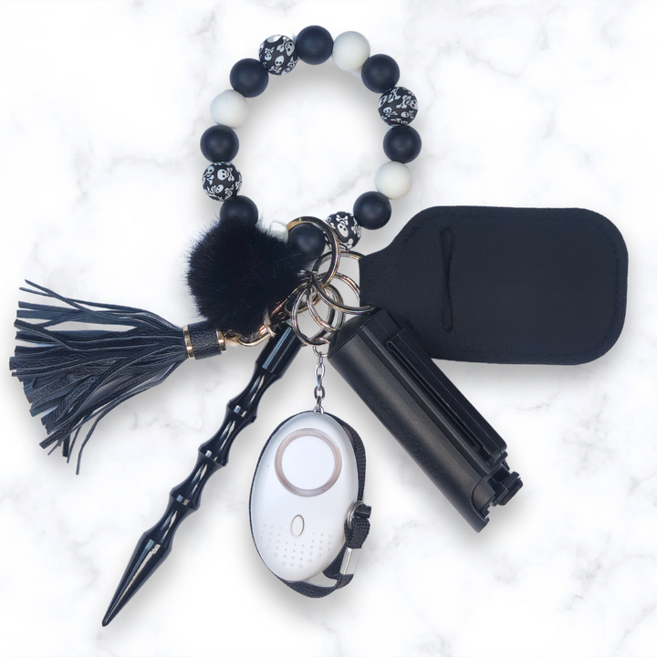 Black and white silicone beaded safety keychain set with pepper spray, alarm, and kubaton.