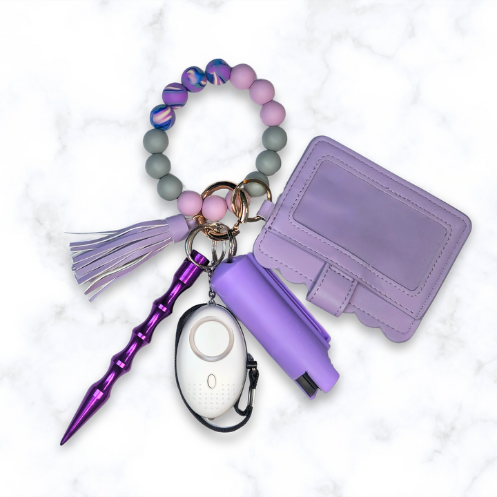 Purple beaded safety keychain set with wallet and alarm.