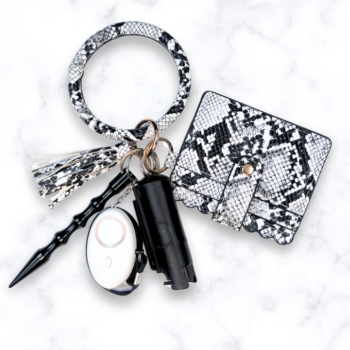 Snake print safety keychain set with pepper spray and wallet. 