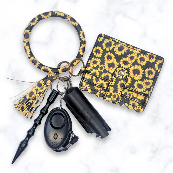 Sunflower ring safety keychain with  wallet, alarm, and pepper spray. 