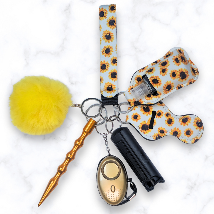 White Sunflower safety keychain set with pepper spray and Kubuton.